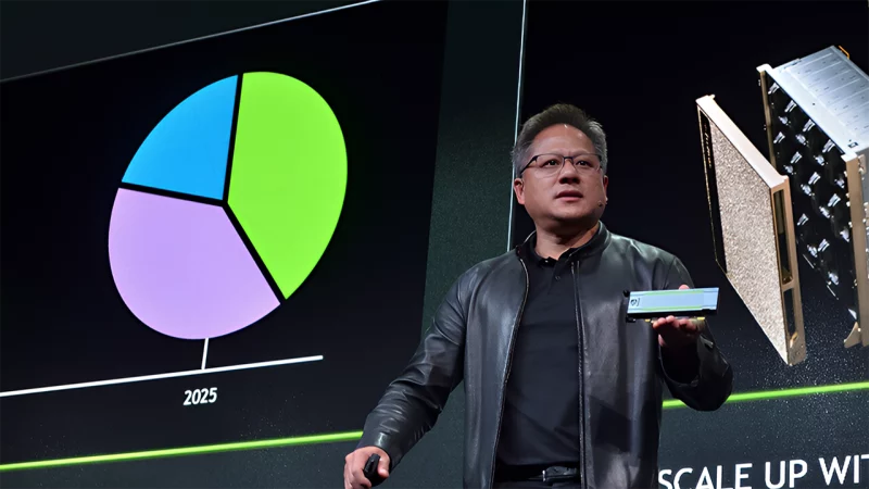 Nvidia CEO Jensen Huang holding up a board of their AI chipset